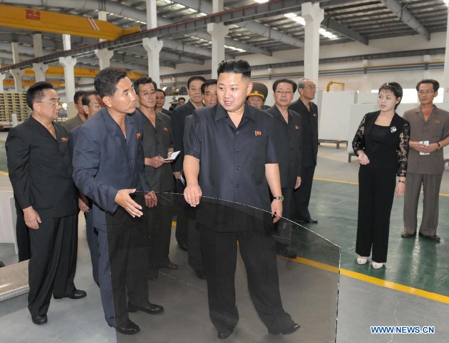 Photo released by Korean Central News Agency (KCNA) on Sept. 3, 2012 shows Kim Jong Un (C), top leader of the Democratic People's Republic of Korea (DPRK), inspecting the Taedonggang tile factory in Pyongyang. (Xinhua/KCNA) 