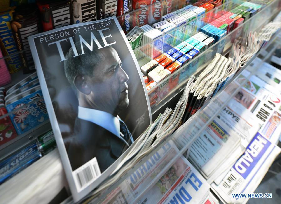 Photo taken on Dec. 21, 2012 in Washionton shows the Time magazine with the cover of Obama who is the person of the year in 2012. Time magazine on Wednesday named the recently re-elected US President Barack Obama as its person of the year for 2012 -- the second time it has accorded him this honor. (Xinhua/Wang Lei)