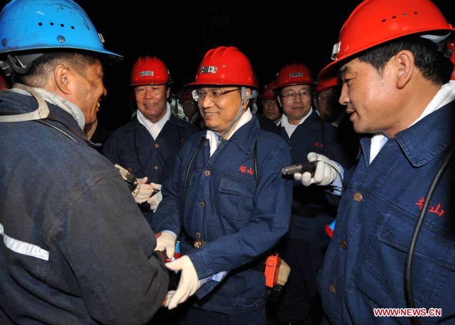 File photo taken on July 28, 2008 shows Li Keqiang visits coal miners in Datong City, north China's Shanxi Province. (Xinhua/Fan Rujun) 