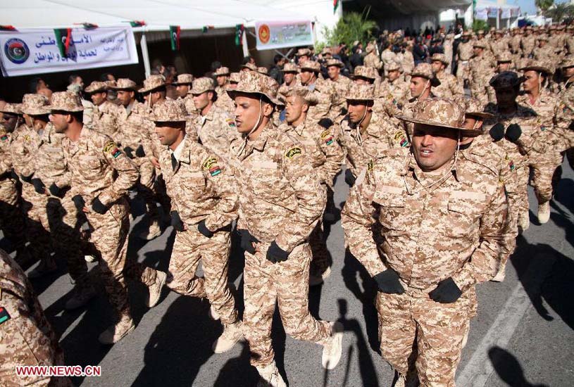 Libyan soldiers attend a parade to mark the 61st anniversary of Independence Day at Martyrs' Square in Tripoli, Libya, Dec. 24, 2012. (Xinhua/Hamza Turkia)