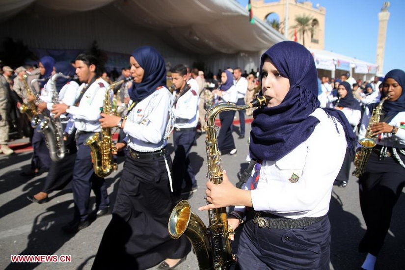 Libyans attend a parade to mark the 61st anniversary of Independence Day at Martyrs' Square in Tripoli, Libya, Dec. 24, 2012. (Xinhua/Hamza Turkia) 