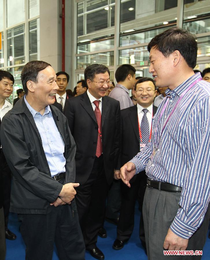 File photo taken on April 15, 2011 shows Wang Qishan (L front) inspects the 109th China Import and Export Fair or the Canton Fair in Guangzhou, capital of south China's Guangdong Province. (Xinhua/Liu Dongping) 