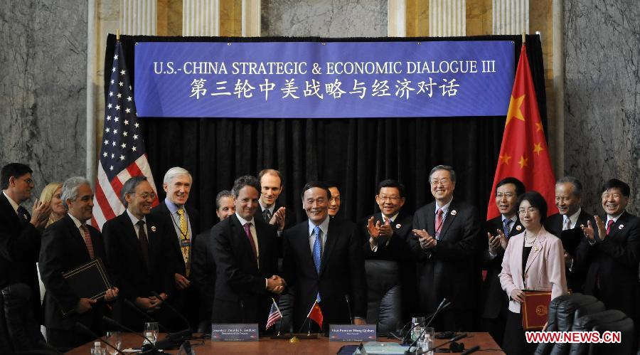 File photo taken on May 10, 2011 shows Wang Qishan (C) attends a signing ceremony of the 3rd round China-U.S. Strategic and Economic Dialogue. (Xinhua) 