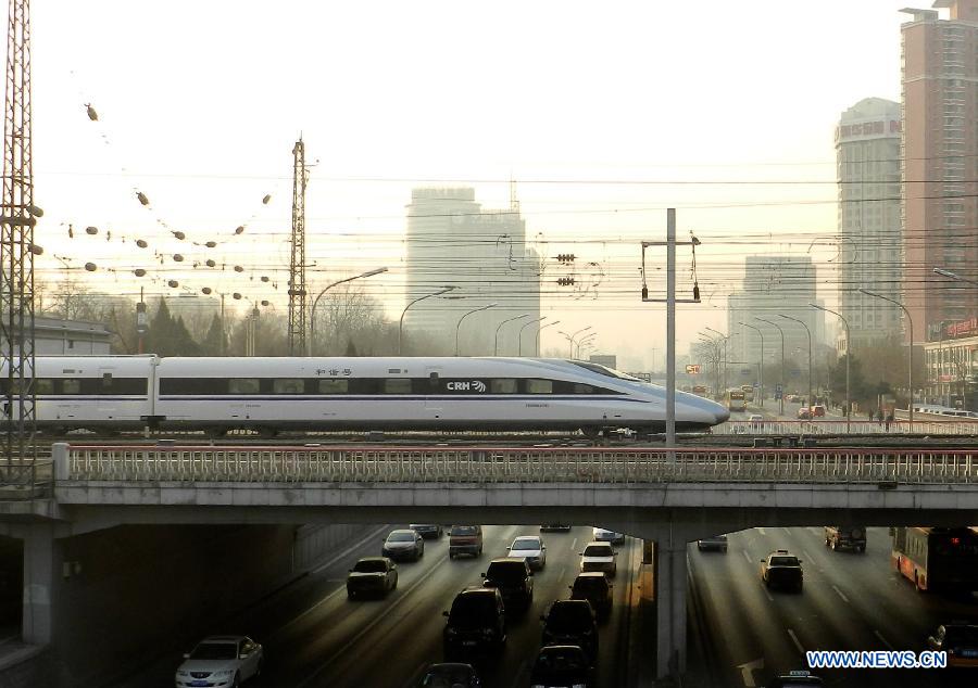 Bullet train G801 leaves the Beijing West Railway Station in Beijing, capital of China, for Guangzhou, capital of south China's Guangdong Province, Dec. 26, 2012. (Xinhua/Wang Zhen)