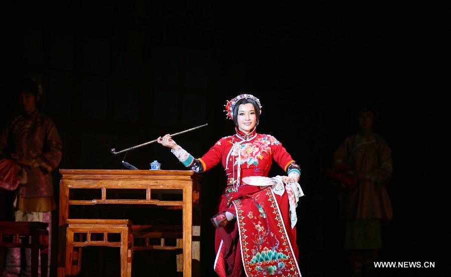 Actress Liu Xiaoqing performs during a stage drama, which tells a story of famous courtesan Sai Jinhua, a legendary but controversial figure in the late Qing Dynasty (1644-1911), in Nanjing, capital of east China's Jiangsu Province, Dec. 25, 2012. (Xinhua) 