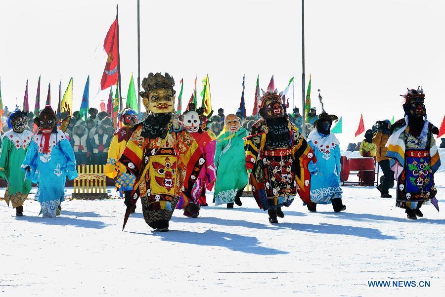 Local fishermen perform sacrifice ceremony ahead of breaking ice and netting fish in the Chagan Lake in Qian Gorlos Mongolian Autonomous County, northeast China's Jilin Province, Dec. 27, 2012. (Xinhua/Ma Caoran)