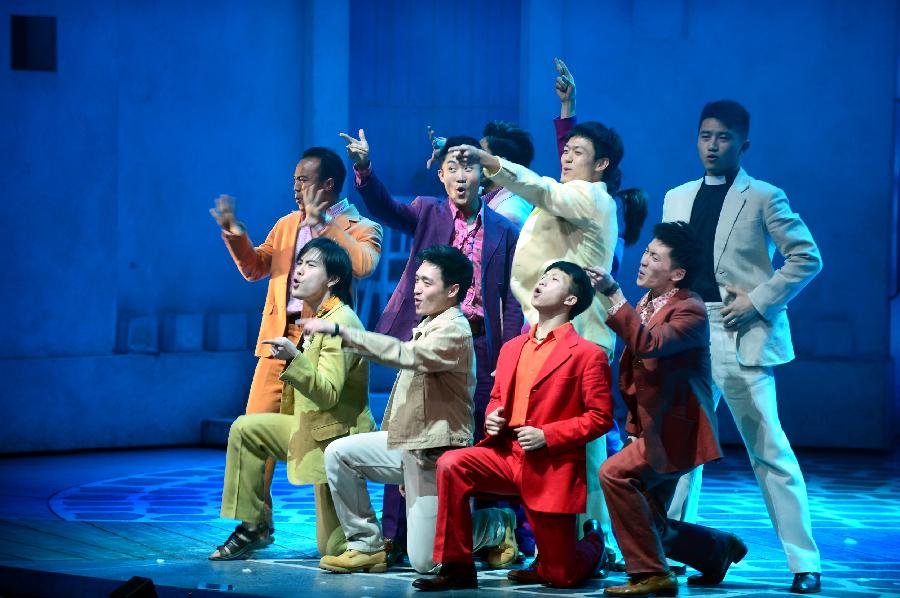 Actors and actresses perform in musical "Mamma Mia!" at the Gansu Grand Theater in Lanzhou, capital of northwest China's Gansu Province, Dec. 26, 2012. The Chinese version of classic musical "Mamma Mia!" was staged in Gansu with six performances starting from Dec. 25. Over 42 million people across the world have seen the musical since the original London production opened in 1999. (Xinhua/Zhang Meng) 