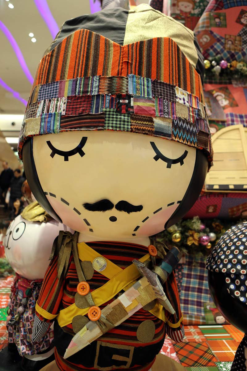 A doll made of textile waste in a Christmas decorations in Hong Kong on Dec. 24, 2012.An “upgrade and refurbishment” Christmas decorations in Telford Plaza in Hong Kong attracted people’s attention. The Christmas decorations made of textile waste will be auctioned to public and the funds raised will be donated to charities. (Xinhua/Li Peng)