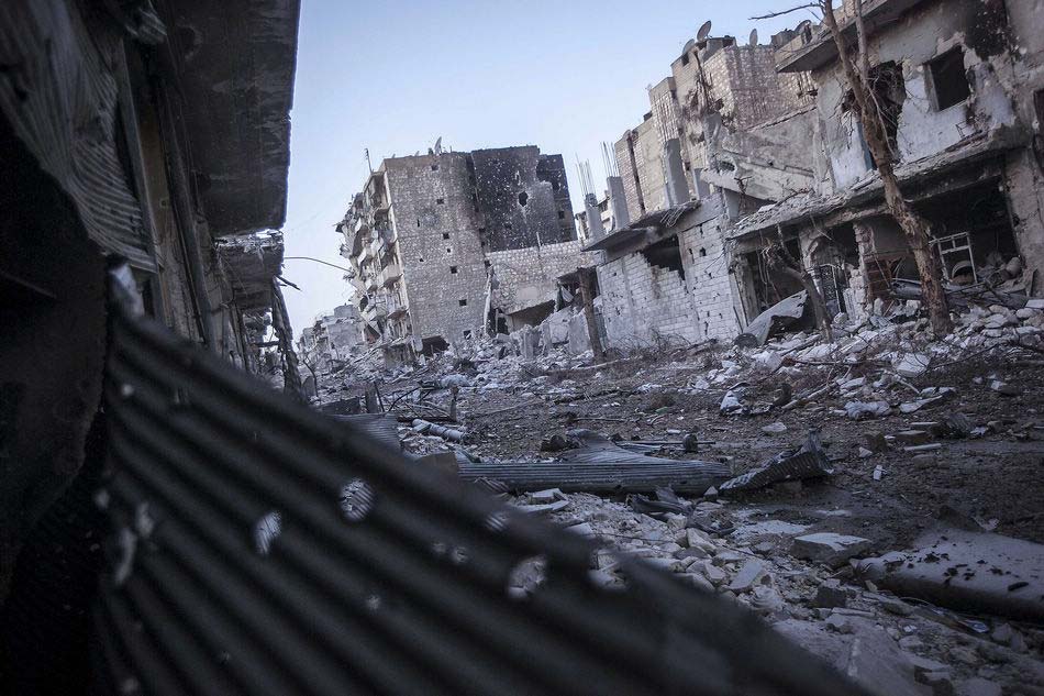 A street devastated by fire shooting in Aleppo, Syria on November 1. (Xinhua/AP)