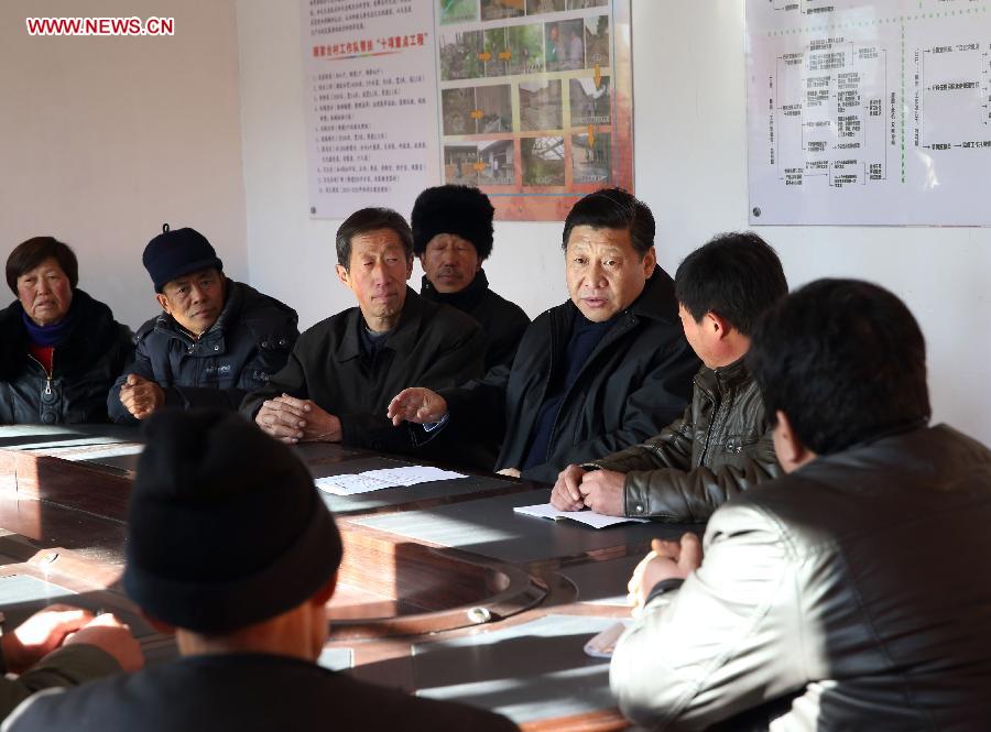 Xi Jinping, general secretary of the Communist Party of China (CPC) Central Committee and chairman of the CPC Central Military Commission, talks with local officials and villagers in the Gujiatai Village of Longquanguan Township, Fuping County, north China's Hebei Province. Xi made a tour to impoverished villages in Fuping County from Dec. 29 to 30, 2012. (Xinhua/Lan Hongguang)