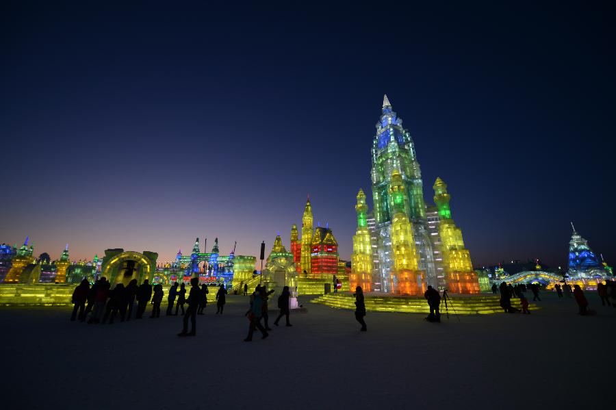 Visitors walk around in the Ice and Snow World during the 29th Harbin International Ice and Snow Festival in Harbin, capital of northeast China's Heilongjiang Province, Jan. 5, 2013. The festival kicked off on Saturday. (Xinhua/Wang Kai)