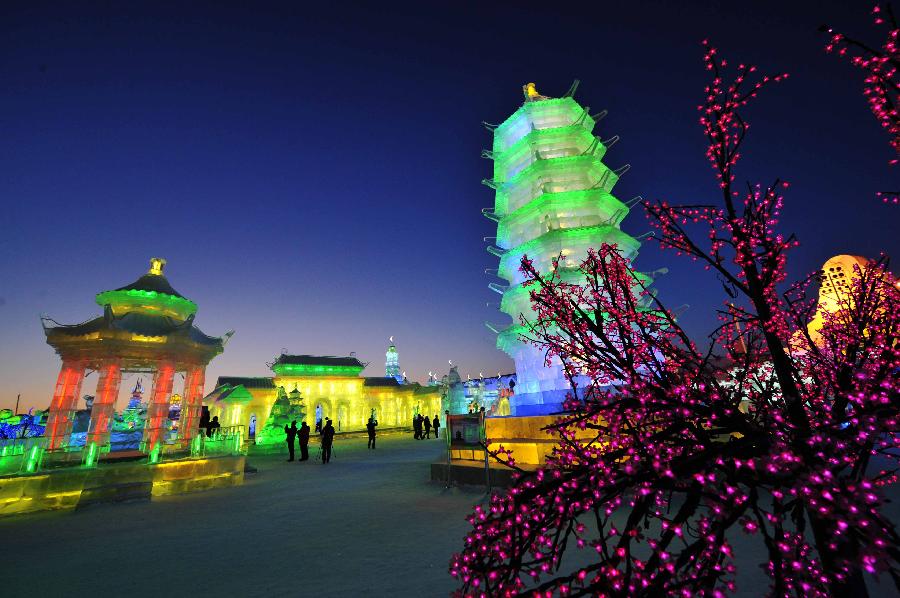 Visitors take photo of the night scenery of the Ice and Snow World during the 29th Harbin International Ice and Snow Festival in Harbin, capital of northeast China's Heilongjiang Province, Jan. 5, 2013. The festival kicked off on Saturday. (Xinhua/Wang Jianwei)