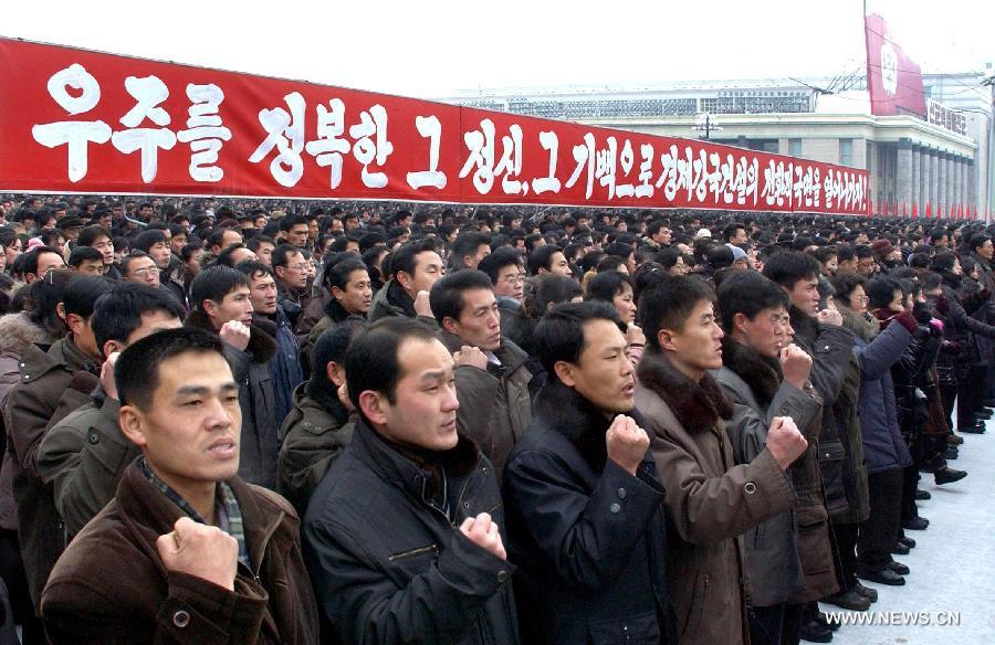 This photo provided by KCNA on Jan. 5, 2013, shows citizens of Pyongyang vowing to implement what top leader Kim Jong Un has urged in his New Year address in Pyongyang, the Democratic People's Republic of Korea (DPRK). Kim Jong Un urged his people to build the country into an economic giant in his New Year address on Tuesday. (Xinhua/KCNA) 