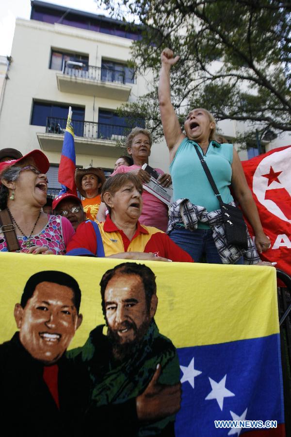 Supporters of Venezuelan President Hugo Chavez participate in a demonstration outside the National Assembly, in Caracas, Venezuela, on Jan. 5, 2013. Venezuelan Vice President Nicolas Maduro said Friday that ailing President Hugo Chavez could be sworn in by the Supreme Court at a later date if he is not able to take the oath of office as scheduled on Jan. 10. (Xinhua/Juan Carlos Hernandez) 