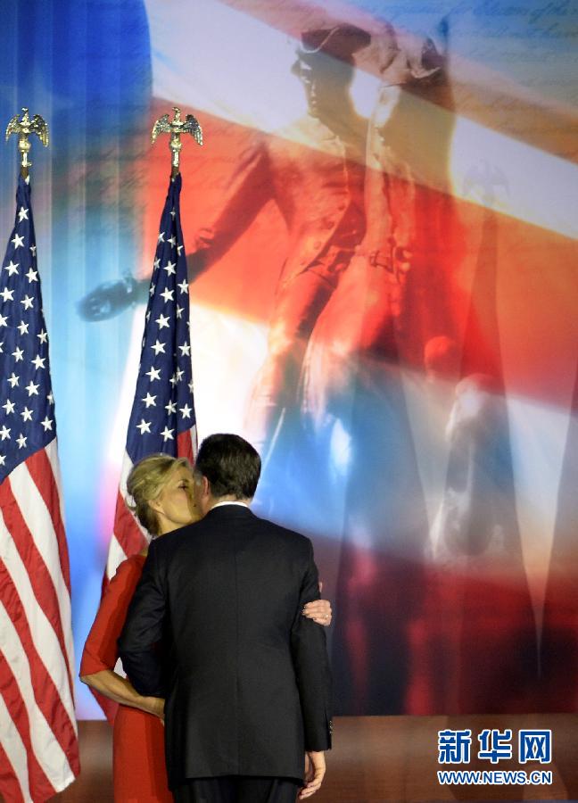 Republican presidential candidate Mitt Romney hugs and kisses his wife, Ann Romney at a party after losing the election in Boston, U.S., Nov. 7, 2012. (Xinhua/Shen Hong)