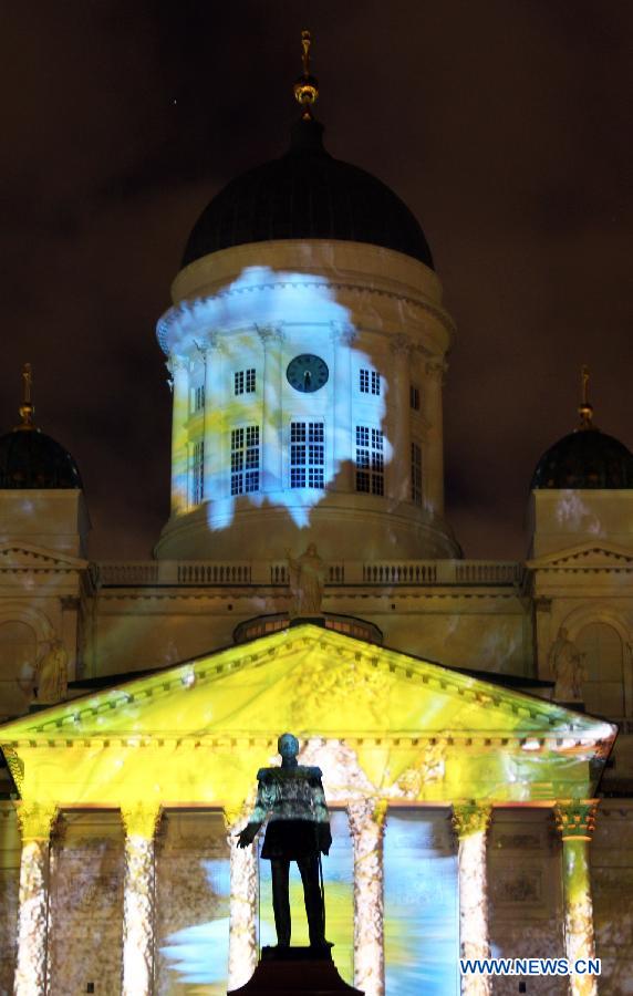 A cathedral is illuminated on the senate square in Helsinki, capital of Finland, on Jan. 6, 2013. Epiphany is celebrated here with an art slide show. (Xinhua/Li Jizhi)