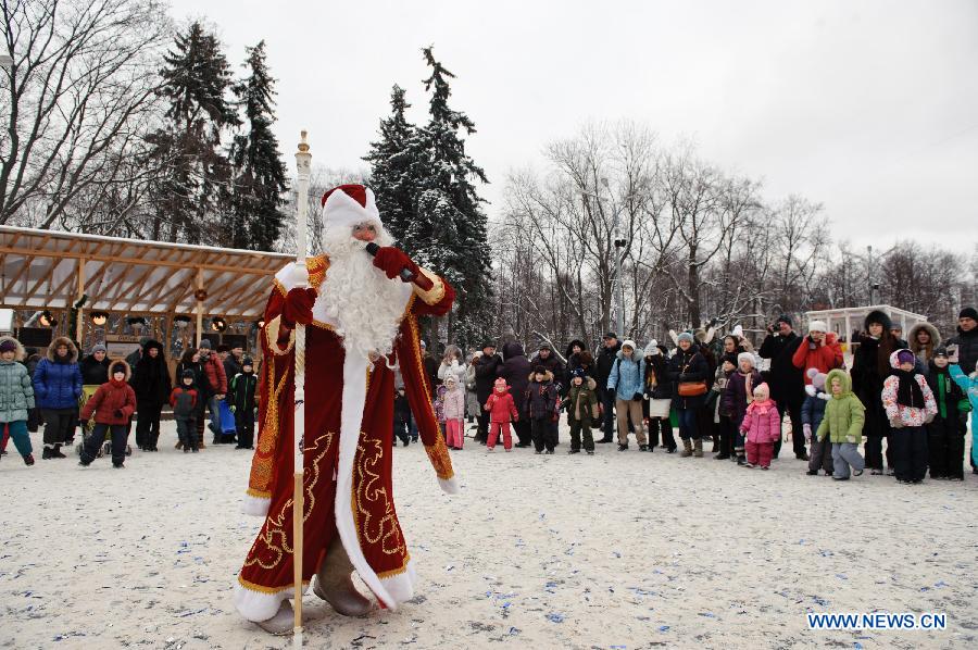 A man dressed as Ded Moroz (Grandfather Frost), the Russian Santa Claus, leads people to dance during a celebration on Orthodox Christmas at Sokolniky Park of Moscow, capital of Russia, on Jan. 7, 2013. Church services took place across Russia from Sunday to Monday to mark the Orthodox Christmas, with thousands of people attending ceremonies to celebrate the holiday. In accordance with the Julian calendar which was introduced by Julius Caesar in 45 B.C., the Orthodox Christmas takes place on Jan. 7, 13 days after the Western Christmas. (Xinhua/Jiang Kehong) 