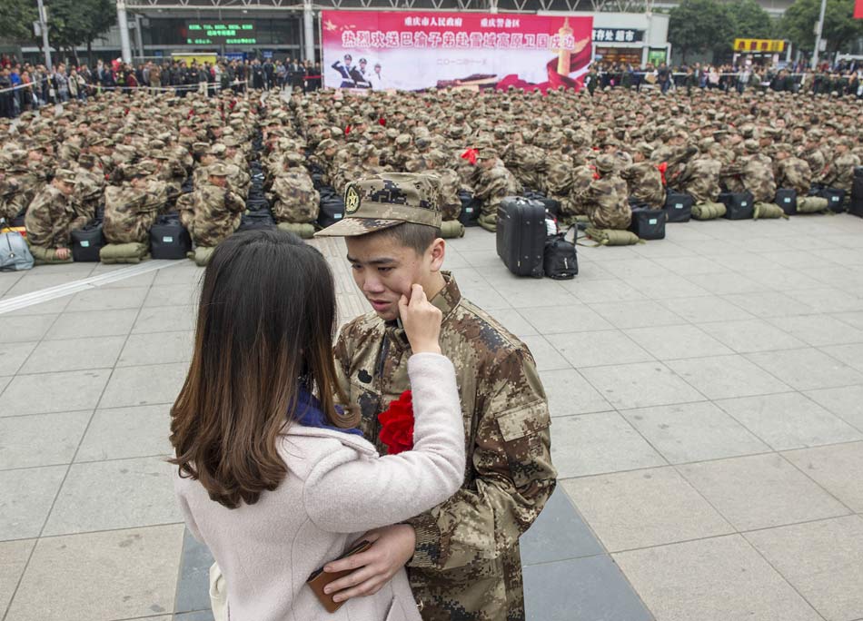 Liu Yan sees off her brother Liu Tao at North Train Station of Chongqing on Nov. 20, 2012. 595 recruits from Fulin, Changshou and other counties of Chongqing left for Tibet by train. (Xinhua/Chen Cheng)