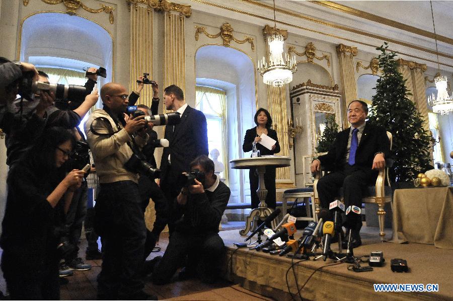 Chinese writer and Nobel Prize in Literature winner Mo Yan (1st R) attends a press conference in Stockholm, capital of Sweden, on Dec. 6, 2012. (Xinhua/Wu Wei) 