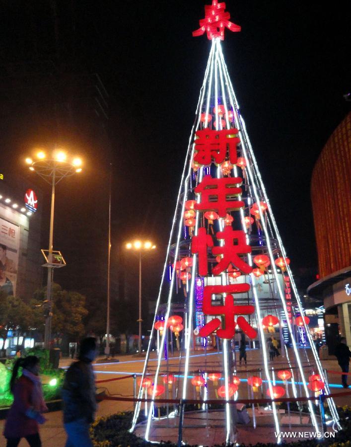 Photo taken on Jan. 9, 2013 shows a colored lantern in the shape of a tree at a square in Suzhou, east China's Jiangsu Province. Various colored lanterns were decorated in Suzhou to greet the upcoming Spring Festival, which falls on Feb. 10 this year. (Xinhua/Wang Jiankang) 