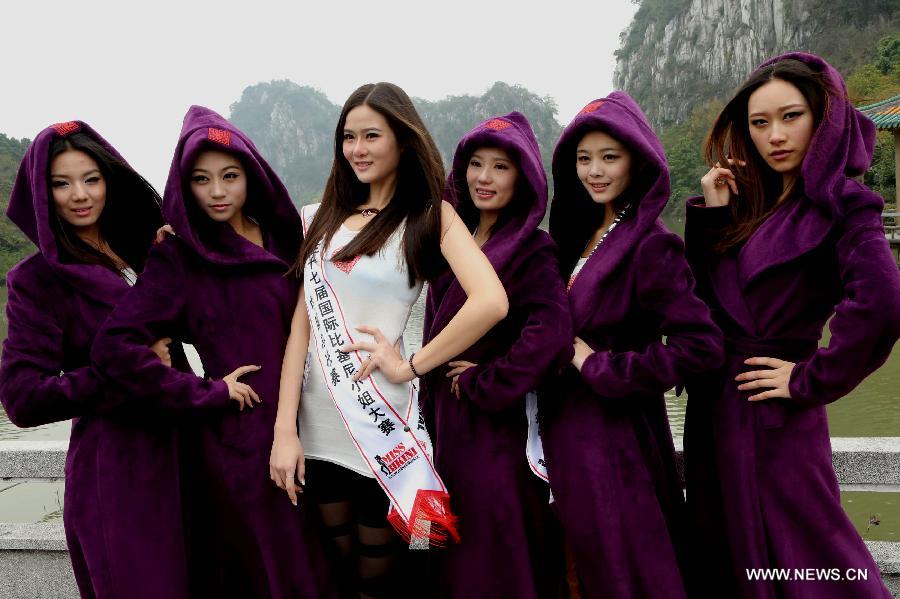 Contestants of the 37th Miss Bikini International Competition pose for a photo in Qixingyan scenery spot in Zhaoqing, south China's Guangdong Province, Jan. 10, 2013. The China final of the competition kicked off here on Jan. 9. (Xinhua/Li Mingfang)