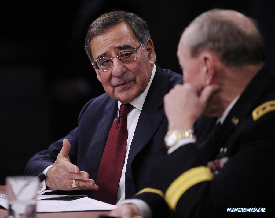 U.S. Defense Secretary Leon Panetta (L) attends a press conference with the U.S. chairman of joint chiefs of staff Martin Dempsey, at the Pentagon in Washington D.C., capital of the United States, Jan. 10, 2013. Panetta on Thursday said he had told the Pentagon to begin preparing for automatic cuts or sequestration, in case Congress fails to prevent it from taking effect in two months' time. (Xinhua/Wang Yiou)