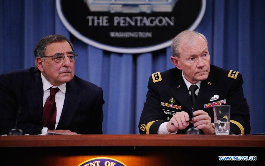 U.S. Defense Secretary Leon Panetta (L) attends a press conference with the U.S. chairman of joint chiefs of staff Martin Dempsey, at the Pentagon in Washington D.C., capital of the United States, Jan. 10, 2013. Panetta on Thursday said he had told the Pentagon to begin preparing for automatic cuts or sequestration, in case Congress fails to prevent it from taking effect in two months' time. (Xinhua/Wang Yiou)