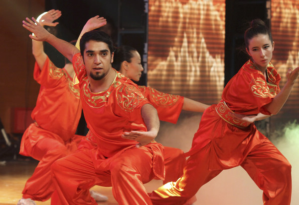 International students from the Capital University of Physical Education and Sports perform kung fu during the Ministry of Education's 2013 New Year reception for international graduates, held at the University of International Business and Economics in Beijing. (Photo by Zhu Xingxin / China Daily)