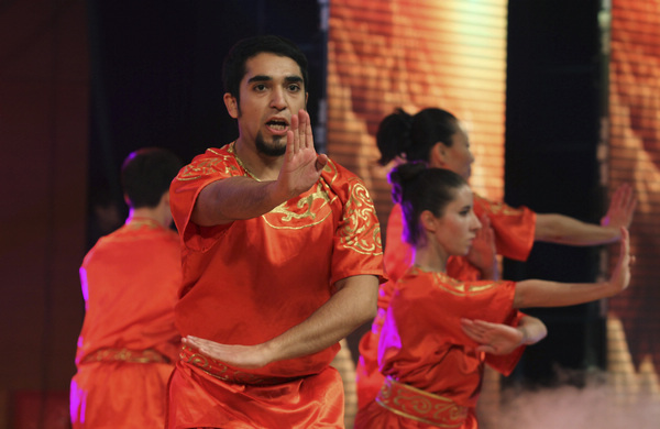 International students from the Capital University of Physical Education and Sports perform kung fu during the Ministry of Education's 2013 New Year reception for international graduates, held at the University of International Business and Economics in Beijing. (Photo by Zhu Xingxin / China Daily)