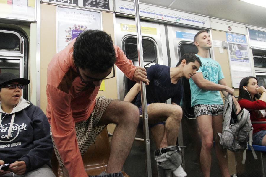 People take off their pants as they take part in the annual "No Pants Subway Ride" in Sao Paulo, Brazil, on Jan. 13, 2013. (Xinhua/Rahel Patrasso)