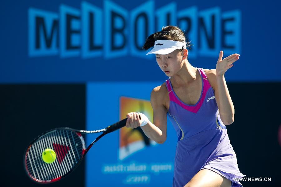 Zhang Yuxuan of China hits a return during her first round women's singles match against Zheng Jie of China on the first day of 2013 Australian Open tennis tournament in Melbourne, Australia, Jan. 14, 2013. Zheng Jie won 2-1. (Xinhua/Bai Xue) 