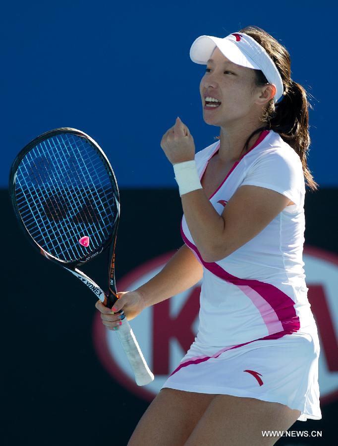 Zheng Jie of China celebrates after scoring during her first round women's singles match against Zhang Yuxuan of China on the first day of 2013 Australian Open tennis tournament in Melbourne, Australia, Jan. 14, 2013. Zheng Jie won 2-1. (Xinhua/Bai Xue) 