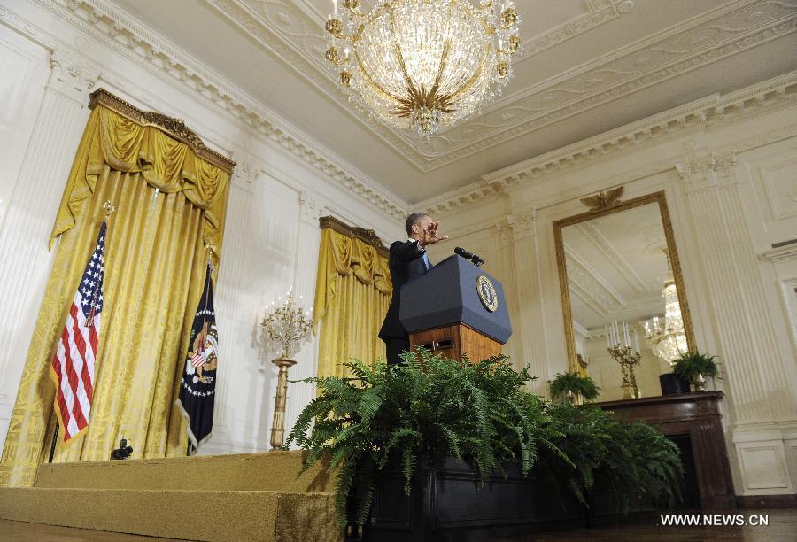 U.S. President Barack Obama holds a press conference in the East Room of the White House in Washington D.C., capital of the United States, Jan. 14, 2013. The United States is making progress in enhancing its fiscal sustainability in the past years as a result of government spending cuts and more government revenue, Obama said here on Monday. (Xinhua/Zhang Jun) 