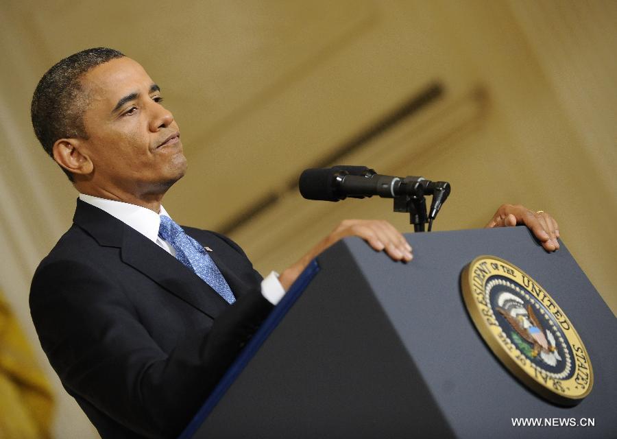 U.S. President Barack Obama holds a press conference in the East Room of the White House in Washington D.C., capital of the United States, Jan. 14, 2013. The United States is making progress in enhancing its fiscal sustainability in the past years as a result of government spending cuts and more government revenue, Obama said here on Monday. (Xinhua/Zhang Jun) 