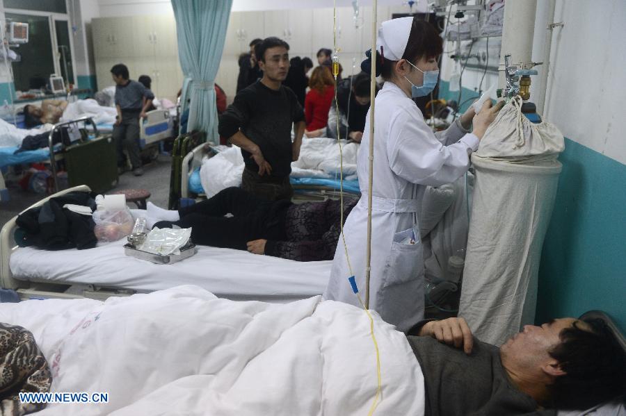 Victims of an accident involving carbon monoxide poisoning at a gold mine receive treatment at Renmin Hospital in Huadian, northeast China's Jilin Province, Jan. 15, 2013. Ten people were killed and 28 others injured after a fire broke out on early Tuesday morning inside the Laojinchang gold mine which resulted in a high density of carbon monoxide. Most of the 28 injured have kept out of danger, except that one seriously injured victim got serious respiratory burns. (Xinhua/Lin Hong) 