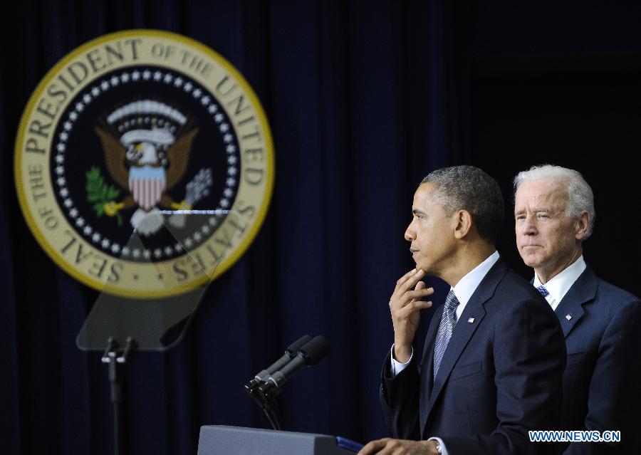 U.S. President Barack Obama and Vice President Joe Biden attend an event on gun violence reduction proposals at the White House in Washington D.C., capital of the United States, Jan. 16, 2013. Obama on Wednesday unveiled a sweeping and expansive package of gun violence reduction proposals, a month after the Sandy Hook Elementary School mass shooting killed 26 people including 20 schoolchildren. (Xinhua/Zhang Jun)