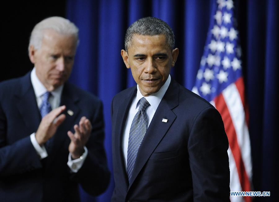 U.S. President Barack Obama and Vice President Joe Biden attend an event on gun violence reduction proposals at the White House in Washington D.C., capital of the United States, Jan. 16, 2013. Obama on Wednesday unveiled a sweeping and expansive package of gun violence reduction proposals, a month after the Sandy Hook Elementary School mass shooting killed 26 people including 20 schoolchildren. (Xinhua/Zhang Jun)