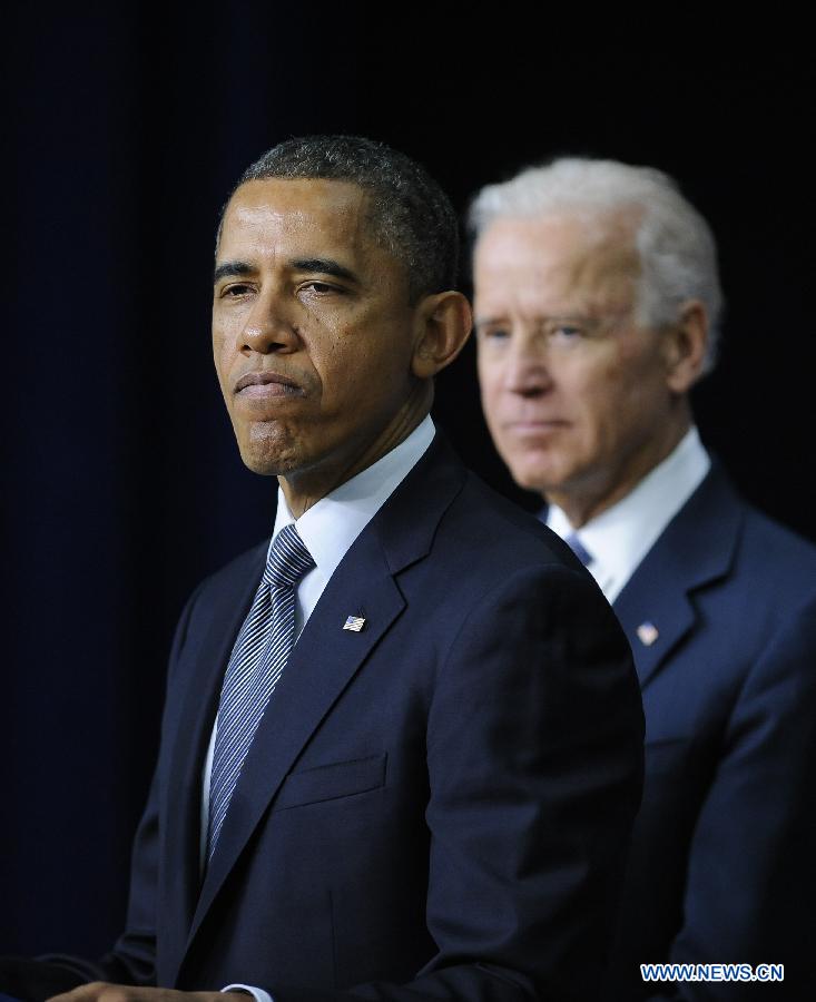 U.S. President Barack Obama and Vice President Joe Biden attend an event on gun violence reduction proposals at the White House in Washington D.C., capital of the United States, Jan. 16, 2013. Obama on Wednesday unveiled a sweeping and expansive package of gun violence reduction proposals, a month after the Sandy Hook Elementary School mass shooting killed 26 people including 20 schoolchildren. (Xinhua/Zhang Jun)