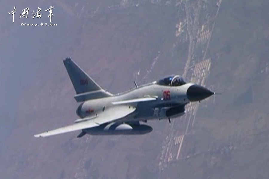 A flight delegation of China's naval air force conducts a long-range raid exercise, and they shoot down the simulated "enemy aircraft" during the exercise. The exercise marked a new breakthrough in their precision raid and actual combat capability. (navy.81.cn/Li Ronglei, Wang Zhenbing)