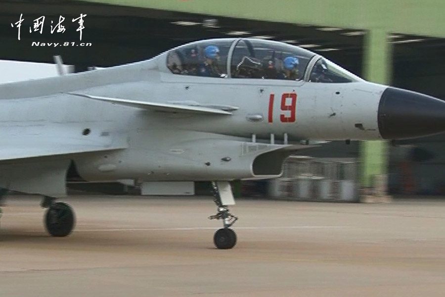 A flight delegation of China's naval air force conducts a long-range raid exercise, and they shoot down the simulated "enemy aircraft" during the exercise. The exercise marked a new breakthrough in their precision raid and actual combat capability. (navy.81.cn/Li Ronglei, Wang Zhenbing)