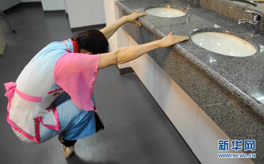 Yao Yao, 60, rehearses dancing before the show on Jan. 15, 2013. 