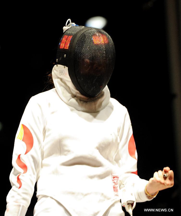 (Xu Anqi of China celebrates during the women's epee final against Ana Maria Branza of Romania at the Grand Prix of Qatar in Doha, Jan. 20, 2013. Xu Anqi won 15-11 and claimed the title. (Xinhua/Chen Shaojin) 