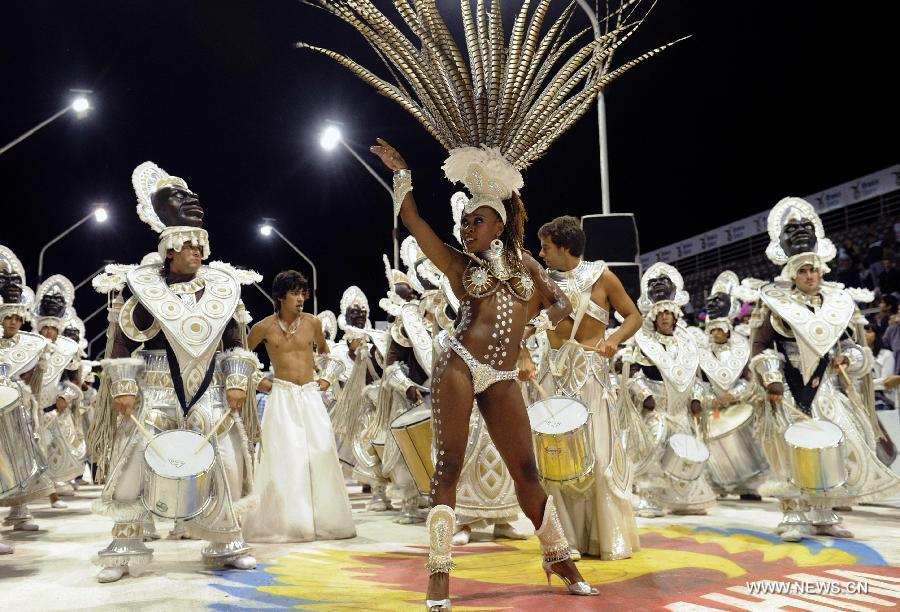 Dancers and musicians perform during the Gualeguaychu Carnival parade, in Entre Rios province, Argentina, in the wee hours of Jan. 20, 2013. More than 18,000 spectators take part in the Gualeguaychu Carnival parade, which is considered to be one of the most important carnivals in Argentina. (Xinhua/Analía Garelli/TELAM) 