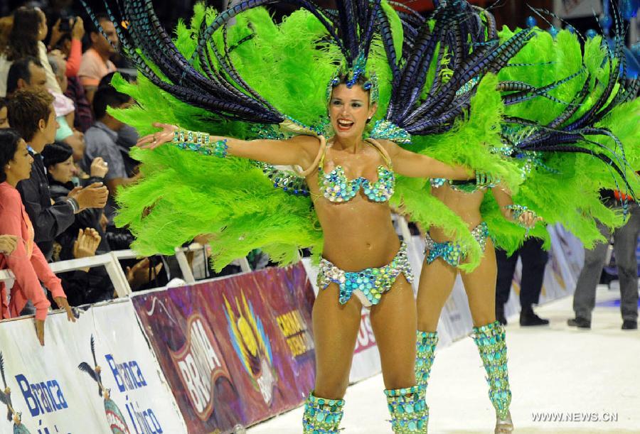 Dancers perform during the Gualeguaychu Carnival parade, in Entre Rios province, Argentina, in the wee hours of Jan. 20, 2013. More than 18,000 spectators take part in the Gualeguaychu Carnival parade, which is considered to be one of the most important carnivals in Argentina. (Xinhua/Analía Garelli/TELAM) 