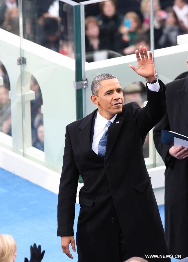 U.S. President Barack Obama waves to the audience after he was sworn in for his second term during the presidential inauguration ceremony on the West Front of the U.S. Capitol in Washington D.C., the United States, on Jan. 21, 2013. (Xinhua/Fang Zhe) 