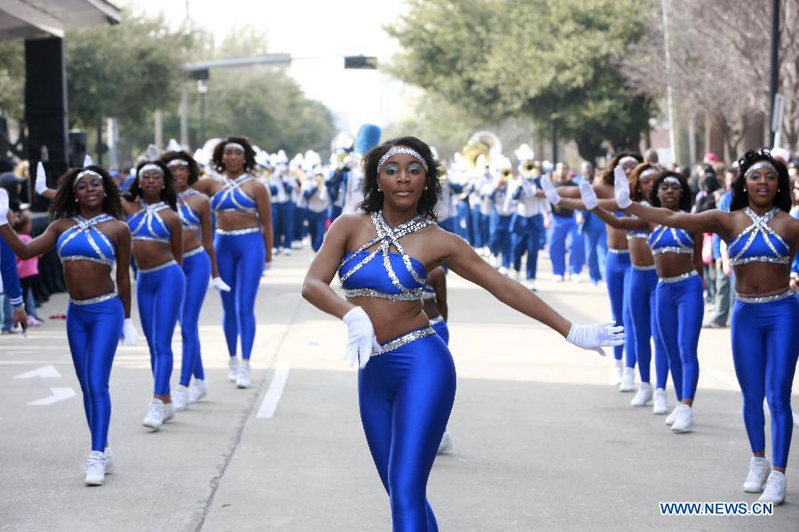 People take part in the Martin Luther King Parade in Houston, the United States, on Jan. 21, 2013. (Xinhua/Song Qiong) 