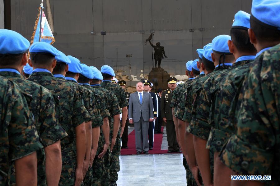 Peruvian Defense Minister Pedro Cateriano Bellido attends a farewell ceremony before members of the Peruvian Blue Beret leaving for Haiti, in Lima, capital of Peru, on Jan. 21, 2013. During the next six months, 216 members of the Peruvian Blue Beret will participate in peacekeeping operations as part of the United Nations Stabilization Missions in Haiti (MINUSTAH). (Xinhua/Luis Camacho) 