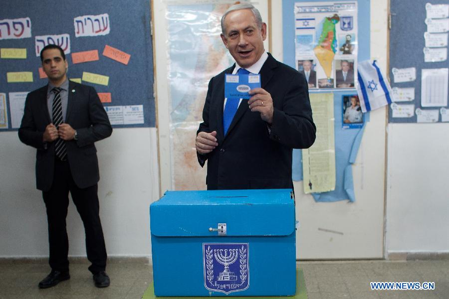 Israeli Prime Minister and the leader of Likud, Benjamin Netanyahu casts his ballot at a polling station during the parliamentary election in Jerusalem, on Jan. 22, 2013. Israel held parliamentary election on Tuesday. (Xinhua/Pool/Uriel Sinai)