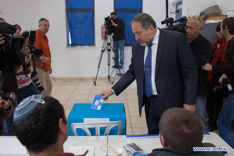 Avigdor Lieberman, leader of Yisrael Beitenu party, casts his ballot for the parliamentary election at a polling station in the Jewish settlement of Nokdim in the West Bank, on Jan. 22, 2013. Israel held parliamentary election on Tuesday. (Xinhua/Jini)