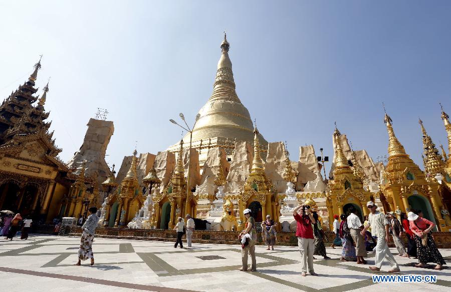 Tourists visit downtown Yangon, Myanmar, on Jan. 24, 2013. Significant reforms and increased exchanges with the international community brought Myanmar over one million person-time of foreign tourists in 2012. (Xinhua/U Aung)